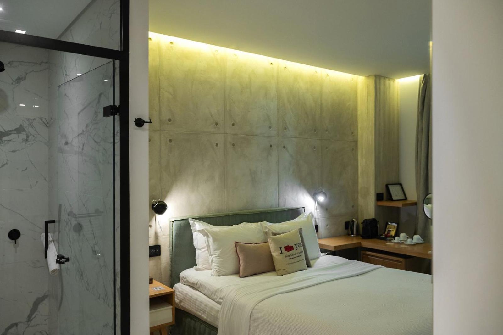 Hotel Coco-Mat Athens Jumelle Exterior foto A room at the hotel