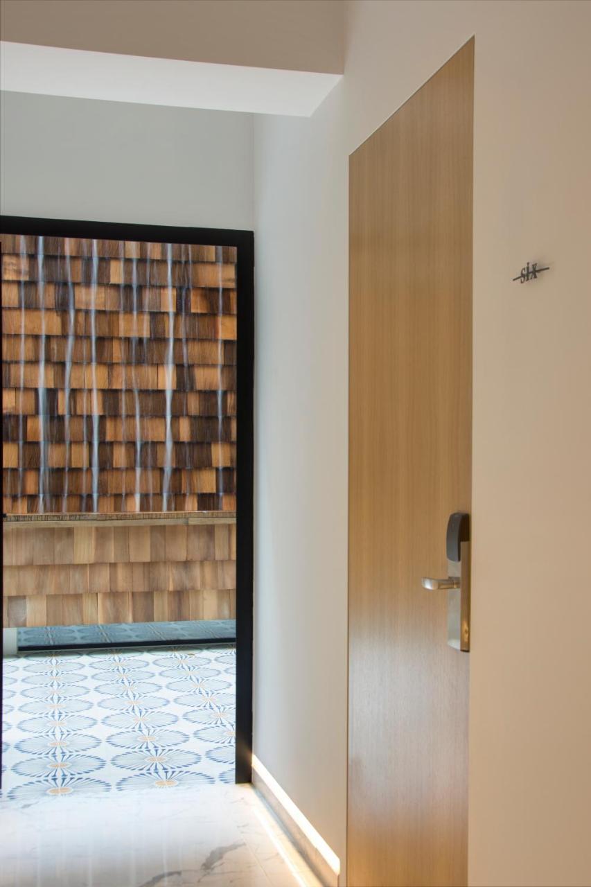 Hotel Coco-Mat Athens Jumelle Exterior foto A door with a water curtain
